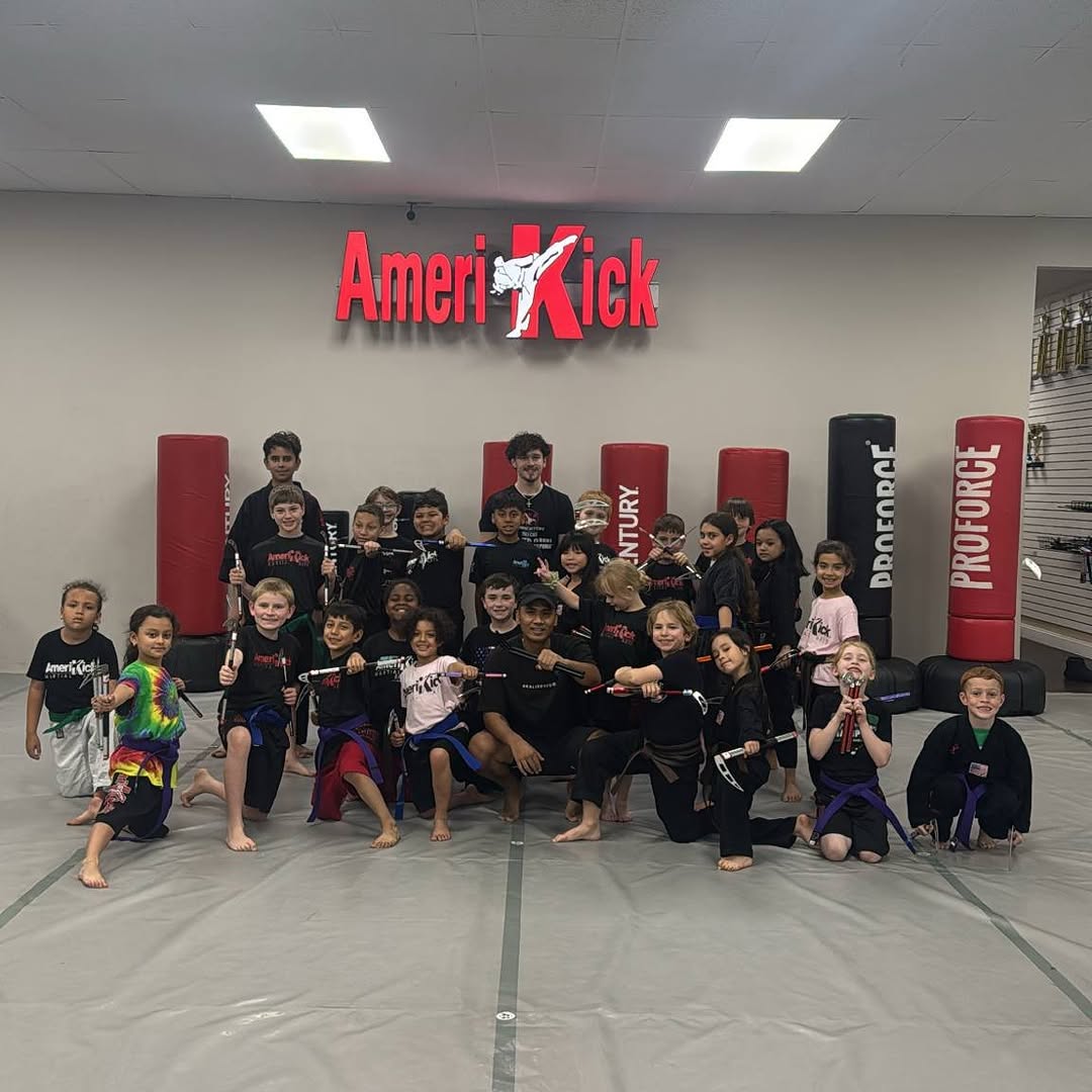 Rudy Reynon II teaching kamas to students at AmeriKick